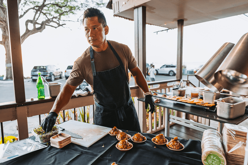 Chef preparing food at Lahaina Food & Wine Festival