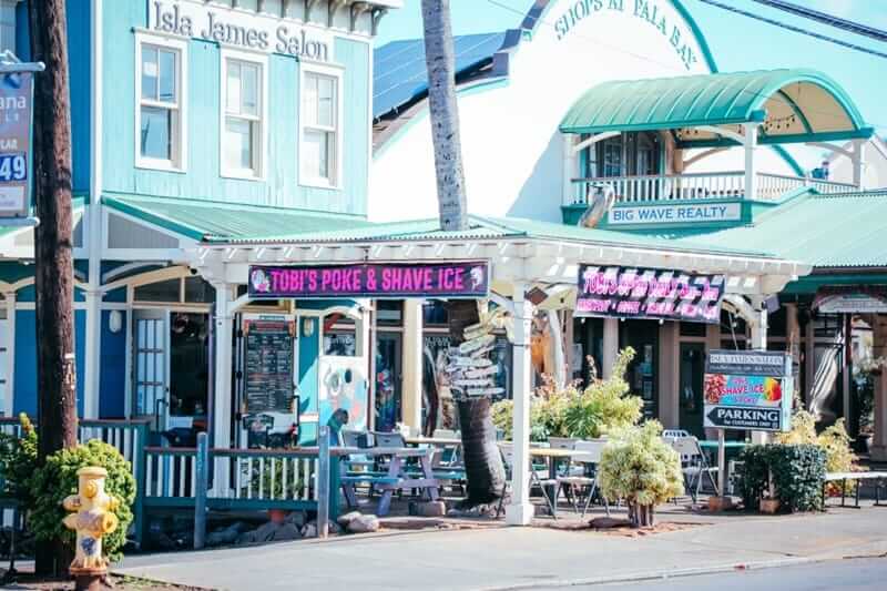 Tobi’s Poke and Shave Ice storefront in Paia Maui with outdoor seating and signage