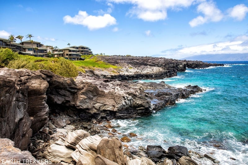 Rocky Maui coastline near tide pools with blue ocean and lava rock