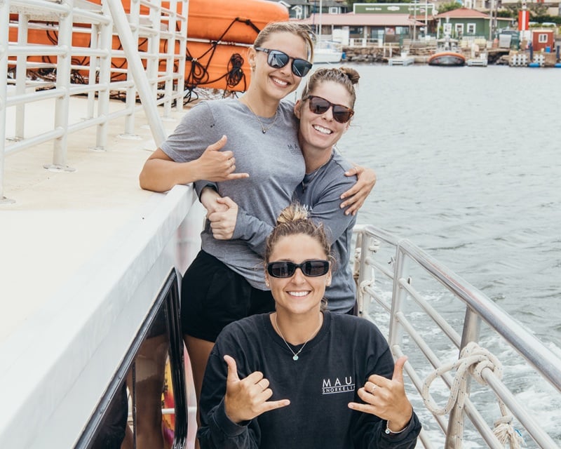 Maui Snorkeling crew smiling aboard the boat