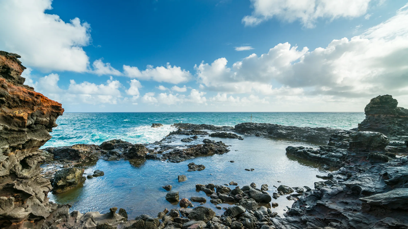 Olivine Pools in Maui with lava rock tide pools and ocean views