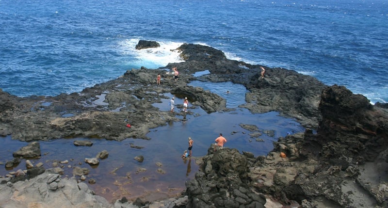 Olivine Pools in Maui with lava rock tide pools and blue ocean