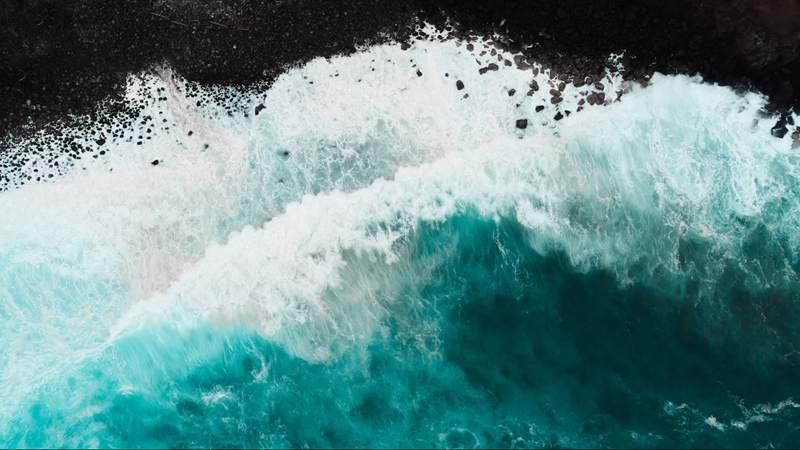 Aerial view of waves along the coastline at Peʻahi, also known as Jaws, on Maui’s North Shore.